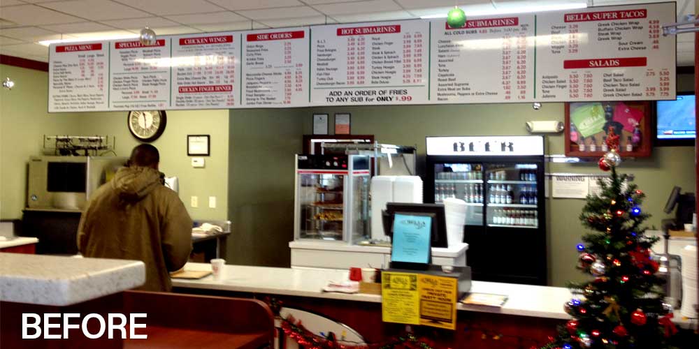 Bella Pizza before: printed text menu boards over the counter