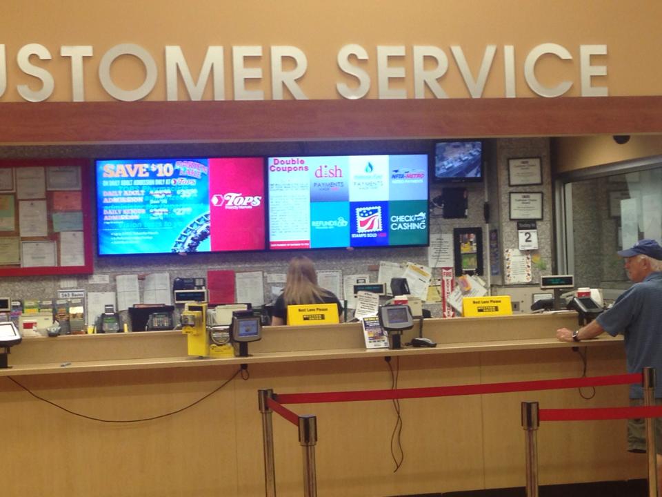 Tops Friendly Markets customer service desk with two impulseGUIDE screens